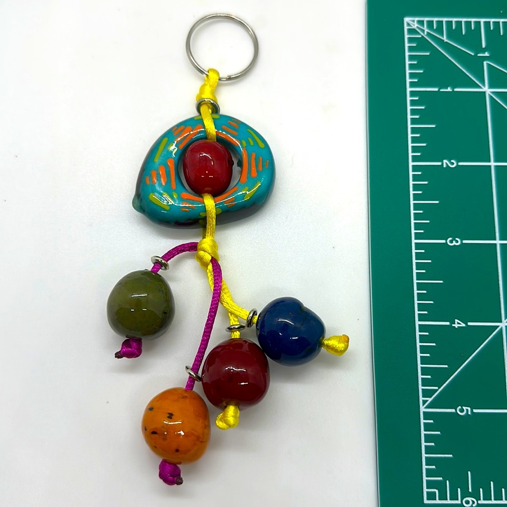 Nice gift item key chain  Handpainted Ecuadorian.  Turquoise shade  Tagua bead.